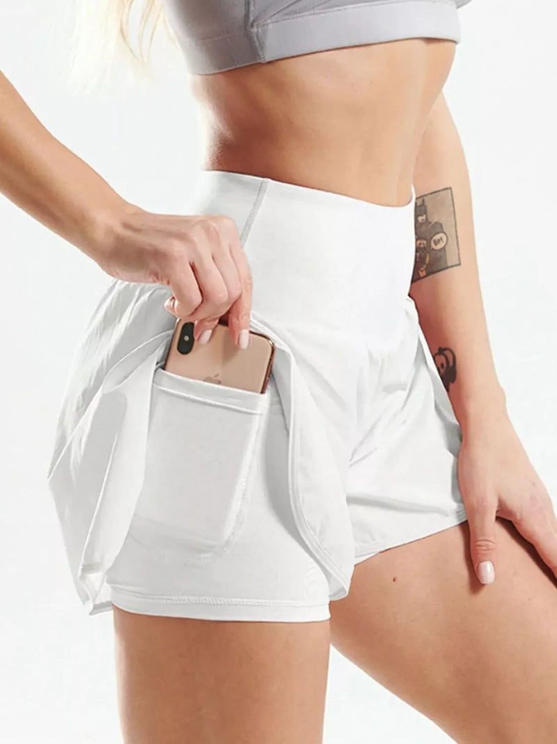 Pocketed high waist active shorts on model, womens shorts collection
