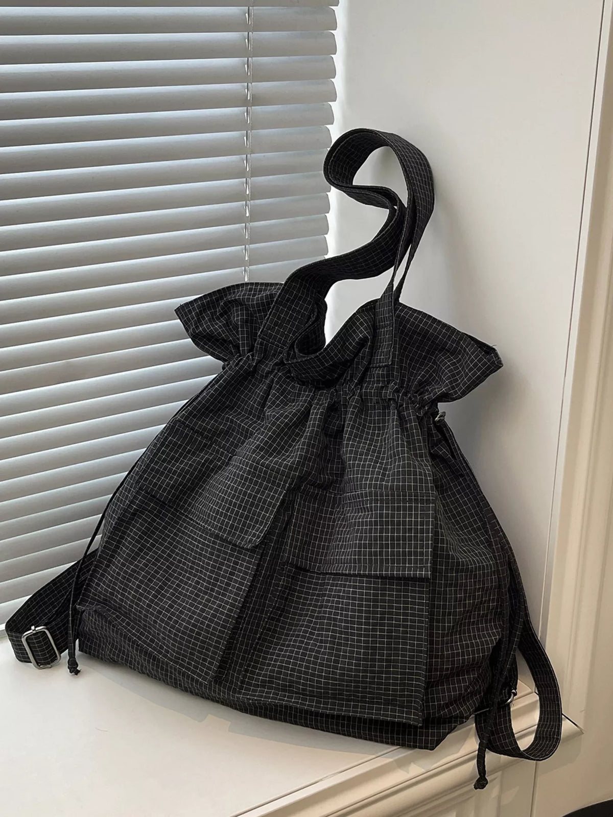 Convertible plaid drawstring backpack open interior