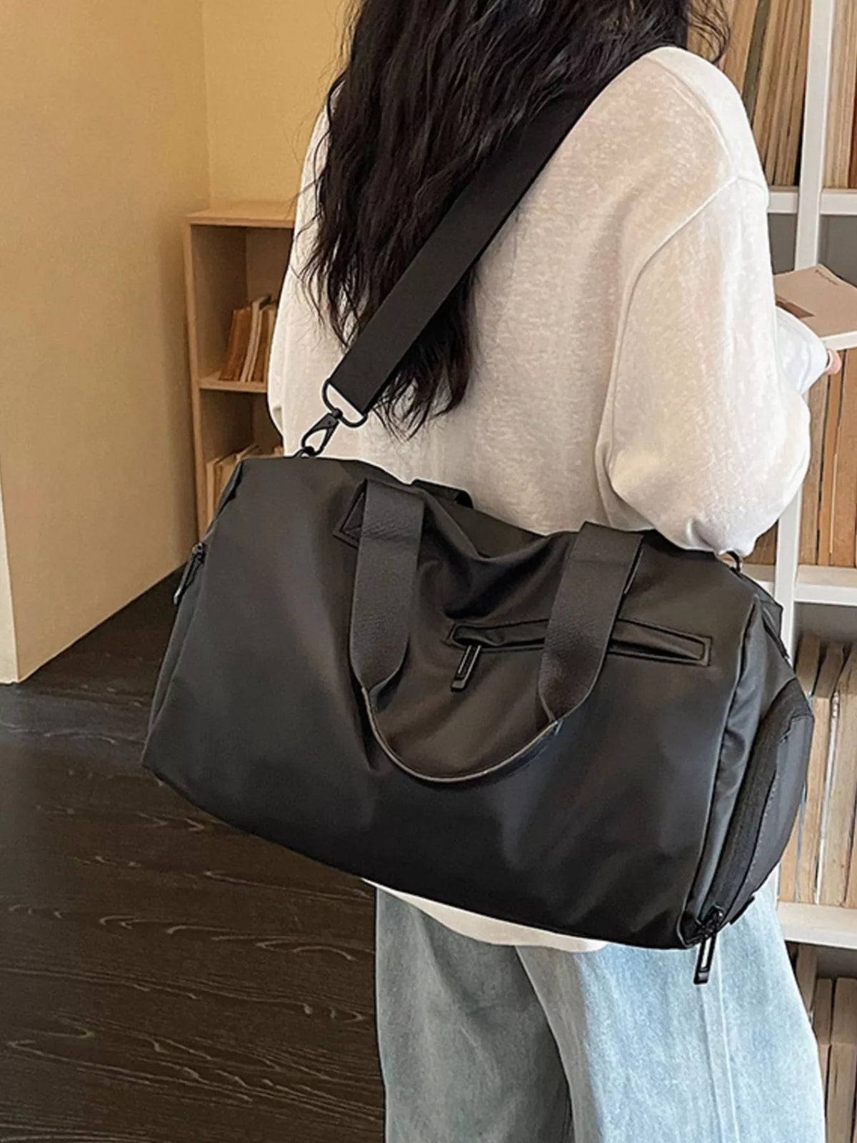 Orange multi pocket duffel back view
