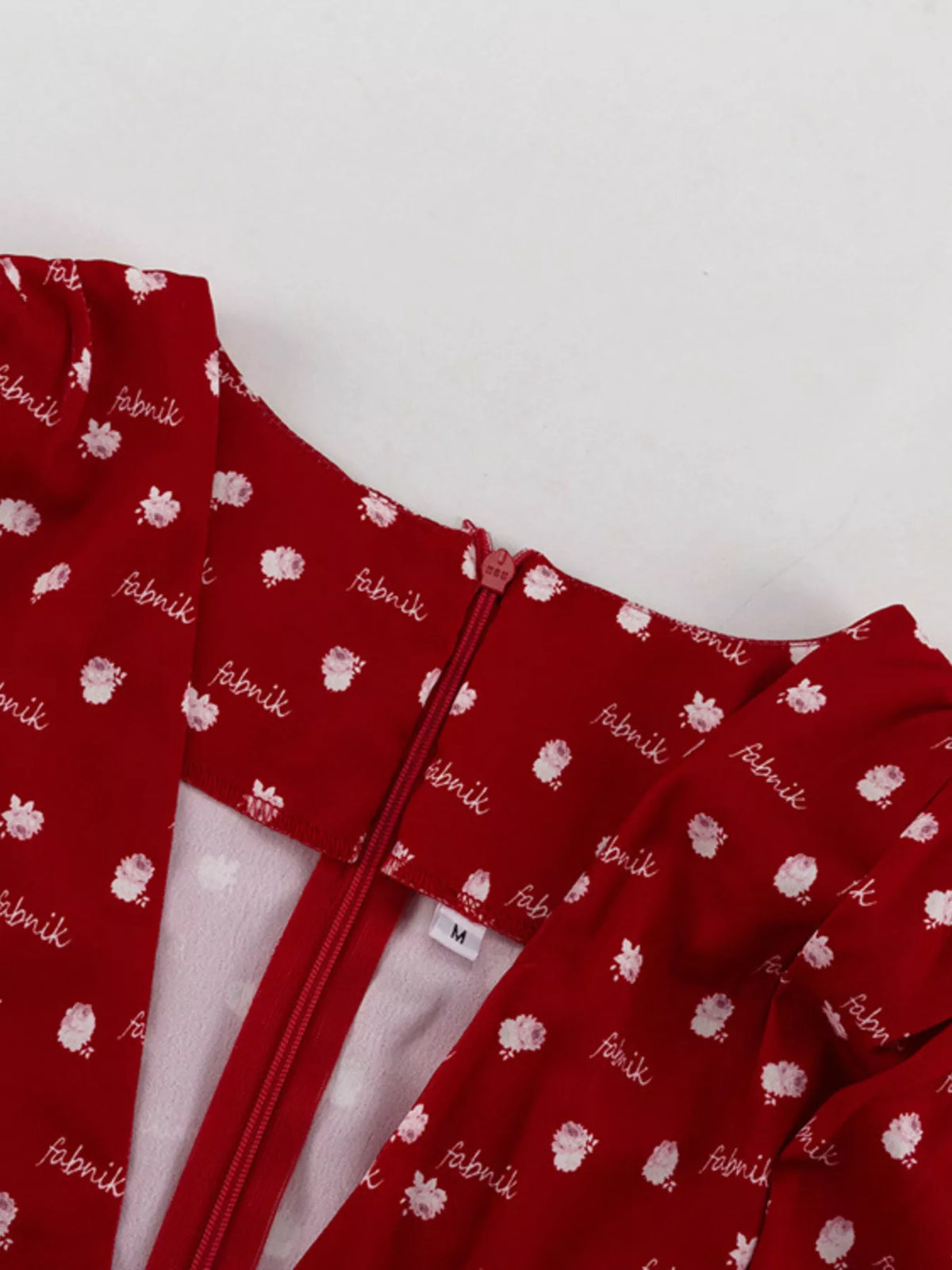Waist and tier seam detail on the scarlet dress