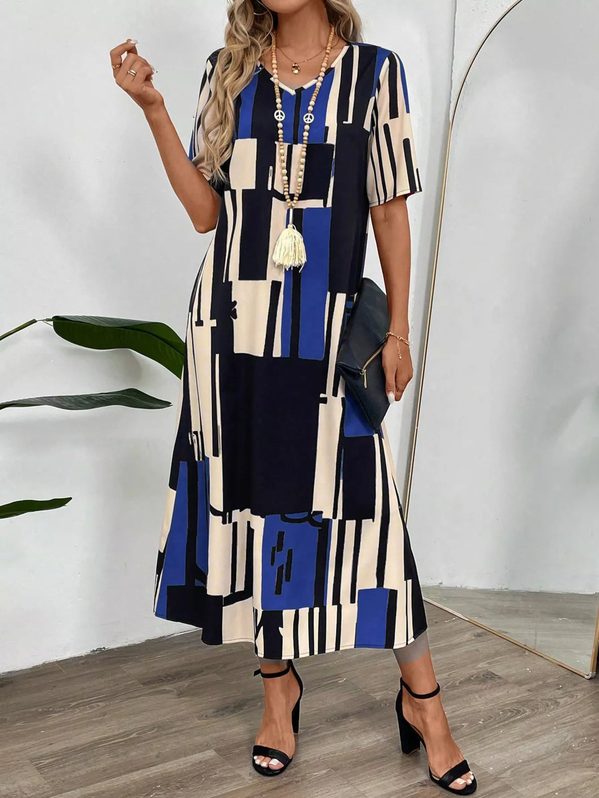 Abstract geometric print v neck midi dress side view