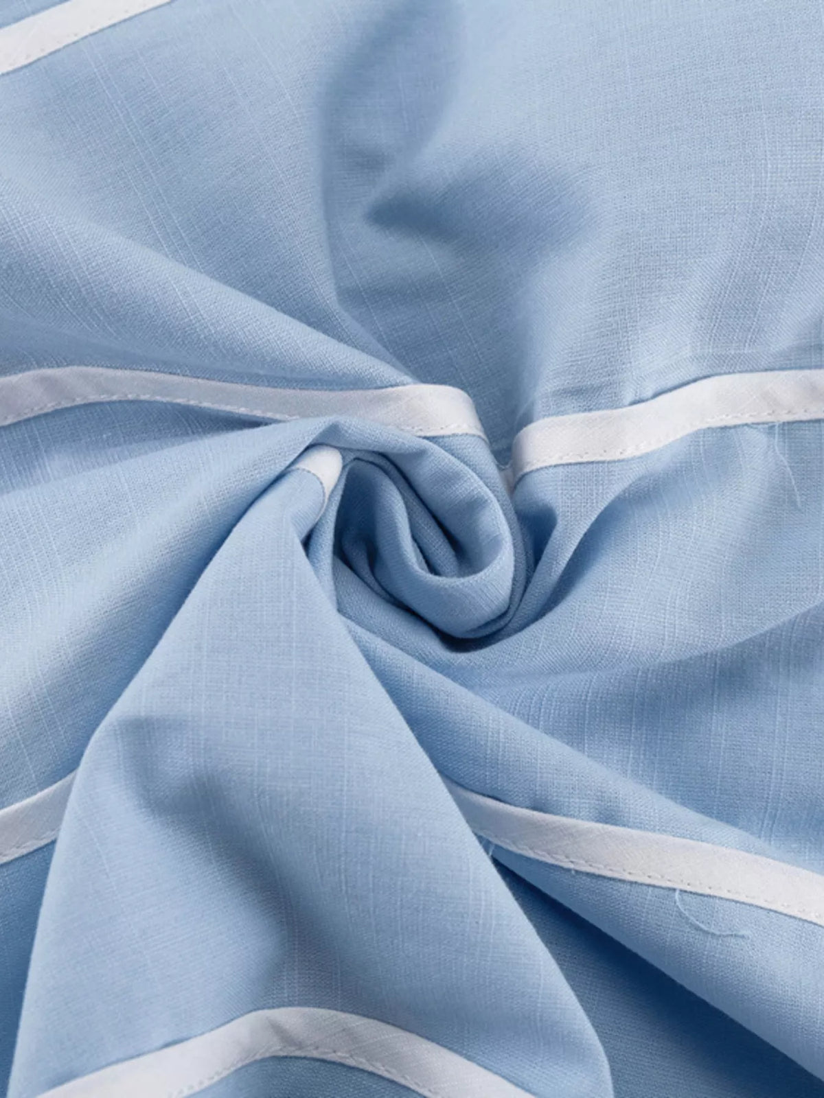 Scalloped hem detail close up