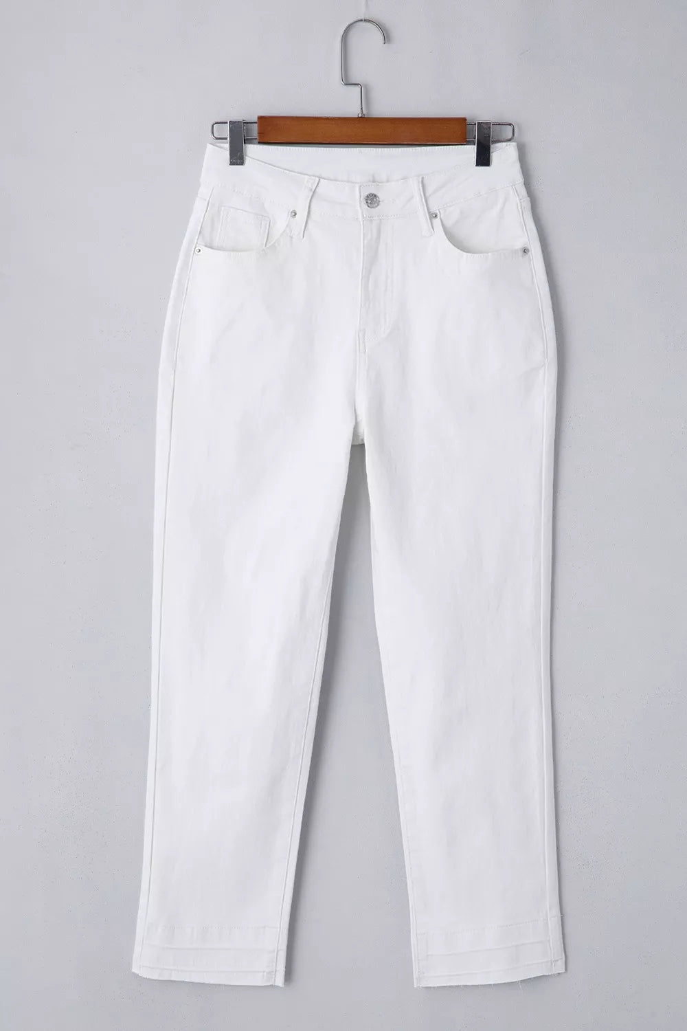 Detail of waistband on white high waist jeans
