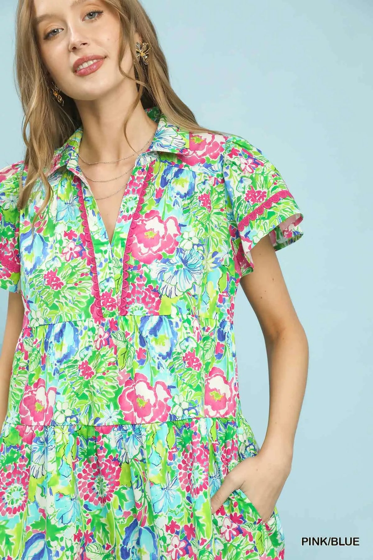 Pink and blue floral tiered midi dress close up view