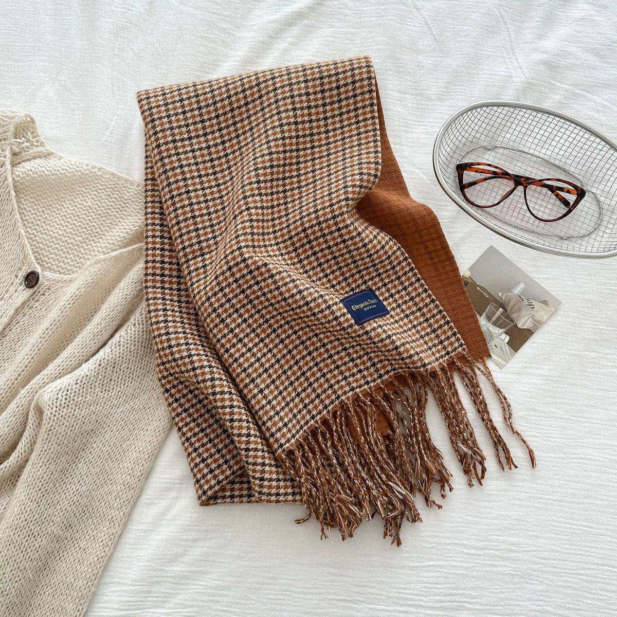 Plaid scarf shown in a warm earthy color mix