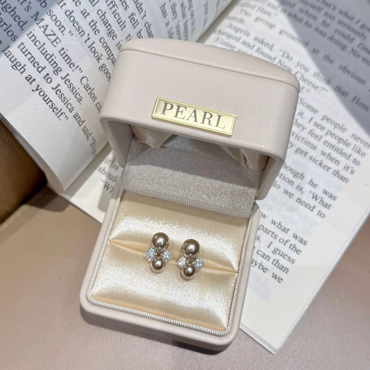 Silver pearl stud earrings styled