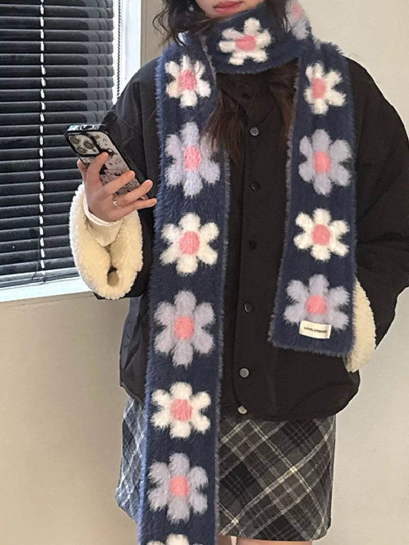 Floral fuzzy knit scarf wrapped around the neck