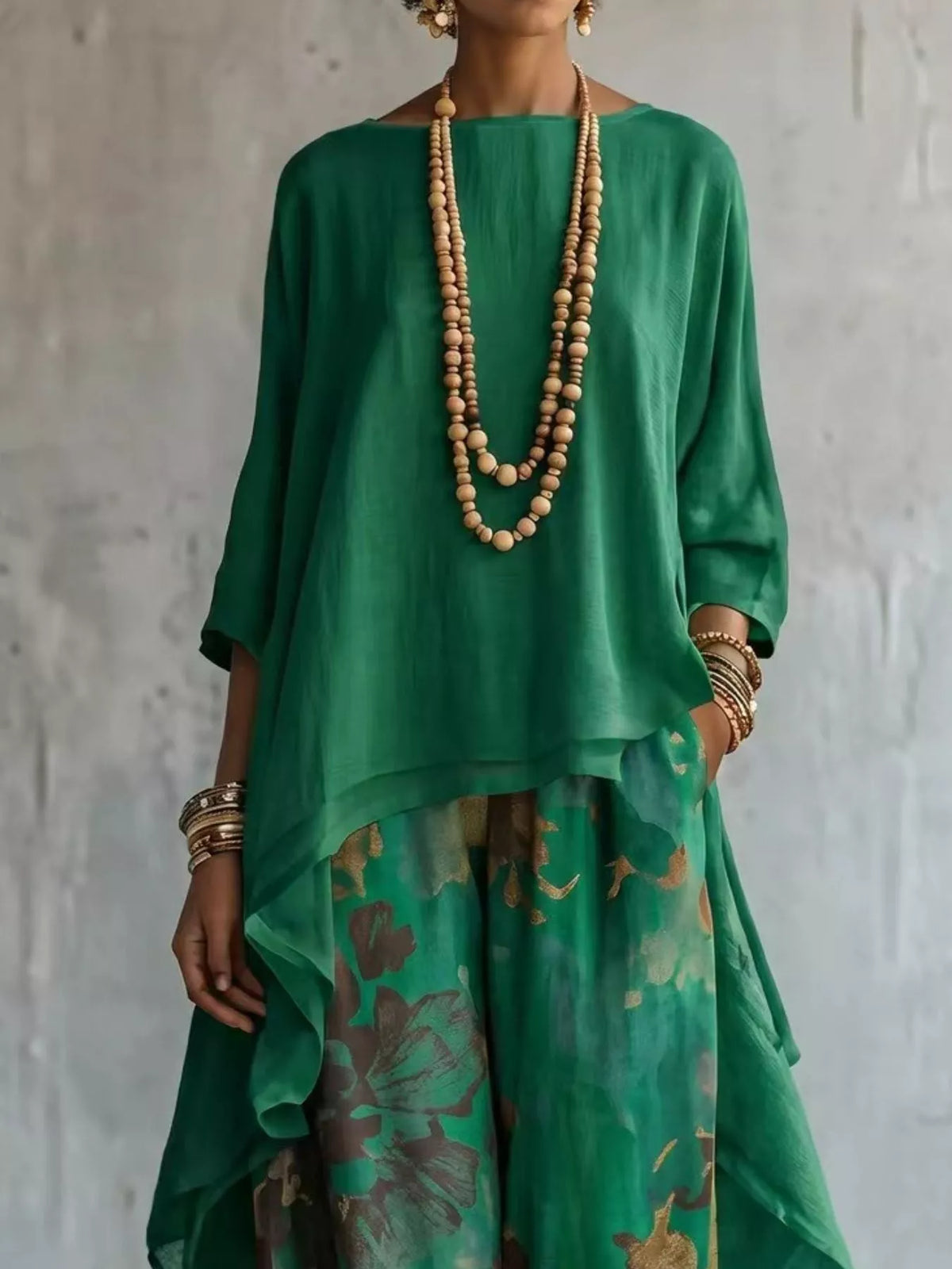 Asymmetrical top and floral pants outfit full length