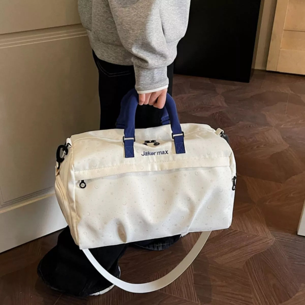 Cream duffel bag angled view