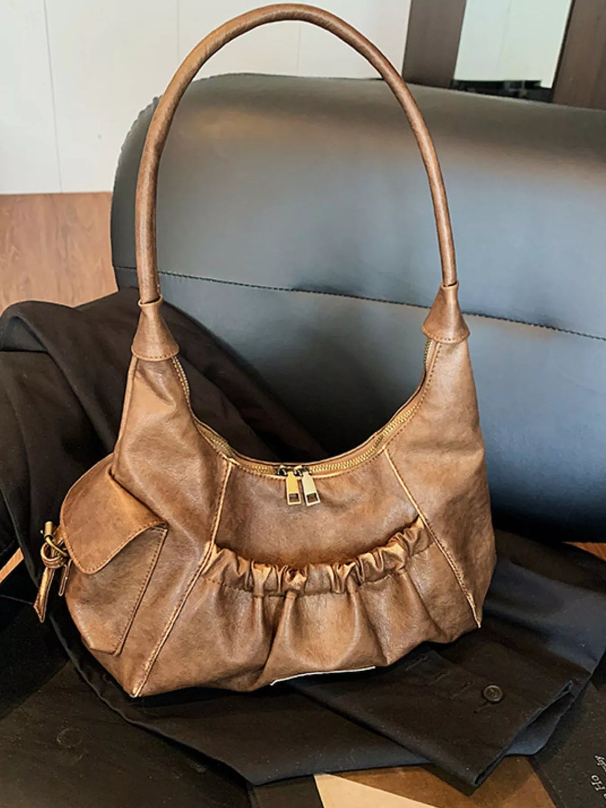 Slouchy hobo bag carried on the shoulder