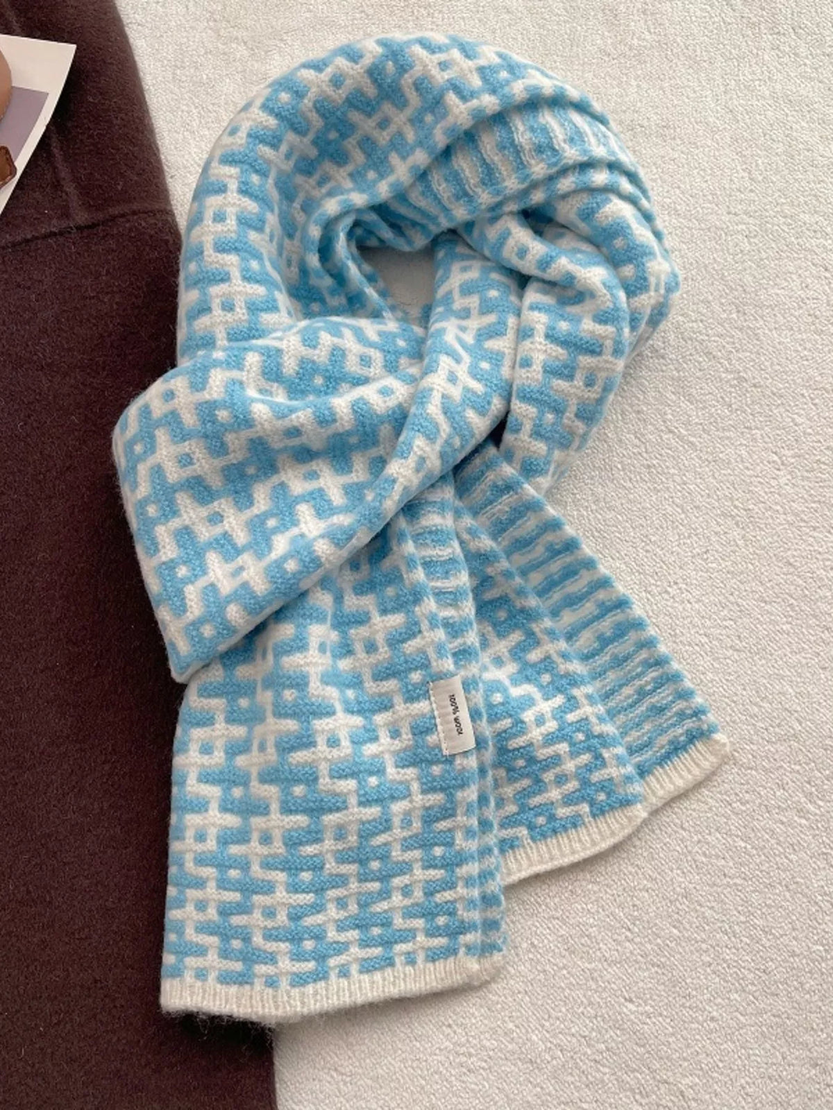 Wool scarf geometric pattern detail close up