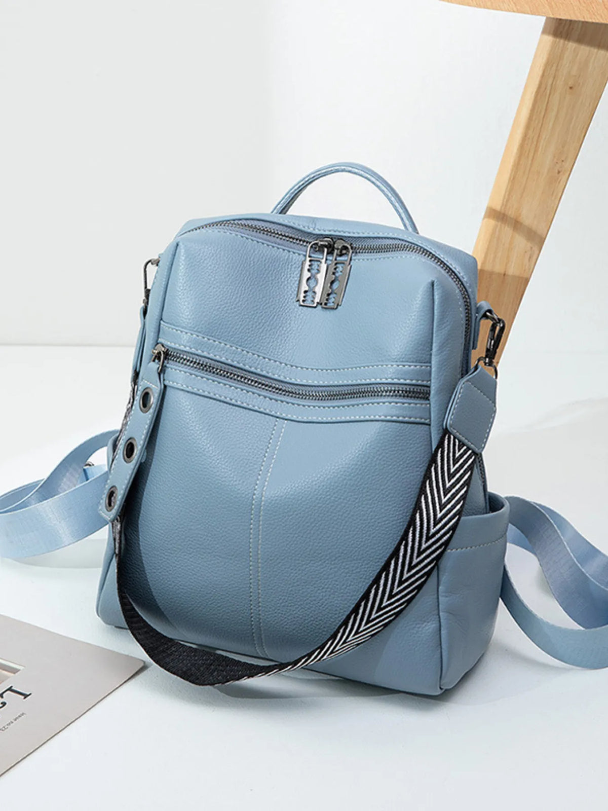 Leather multi compartment backpack side pockets