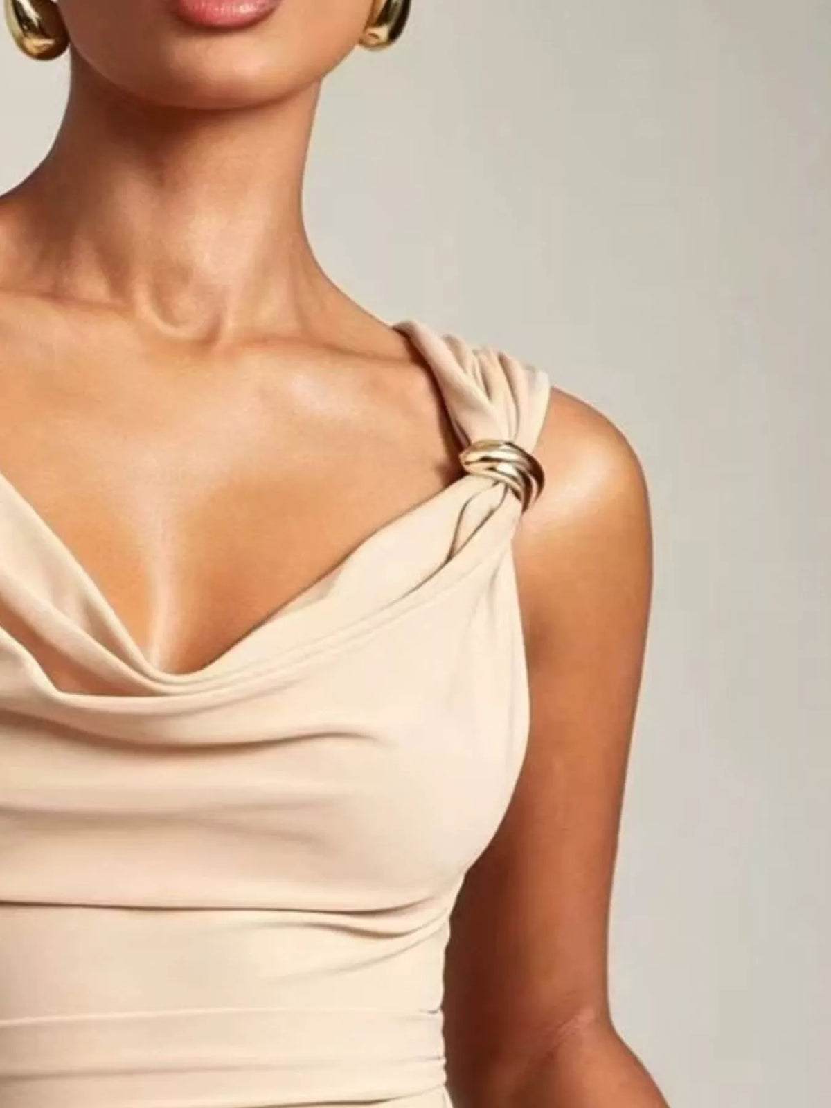 Black cowl neck tank with metal ring accents close up view