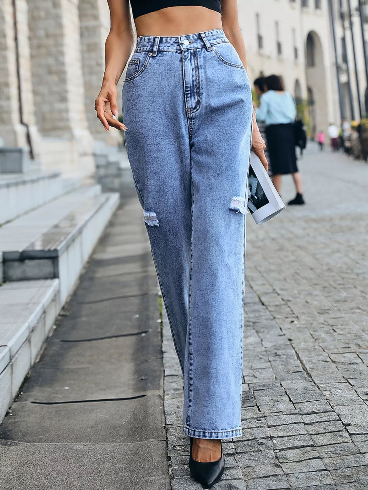Blue distressed jeans side profile