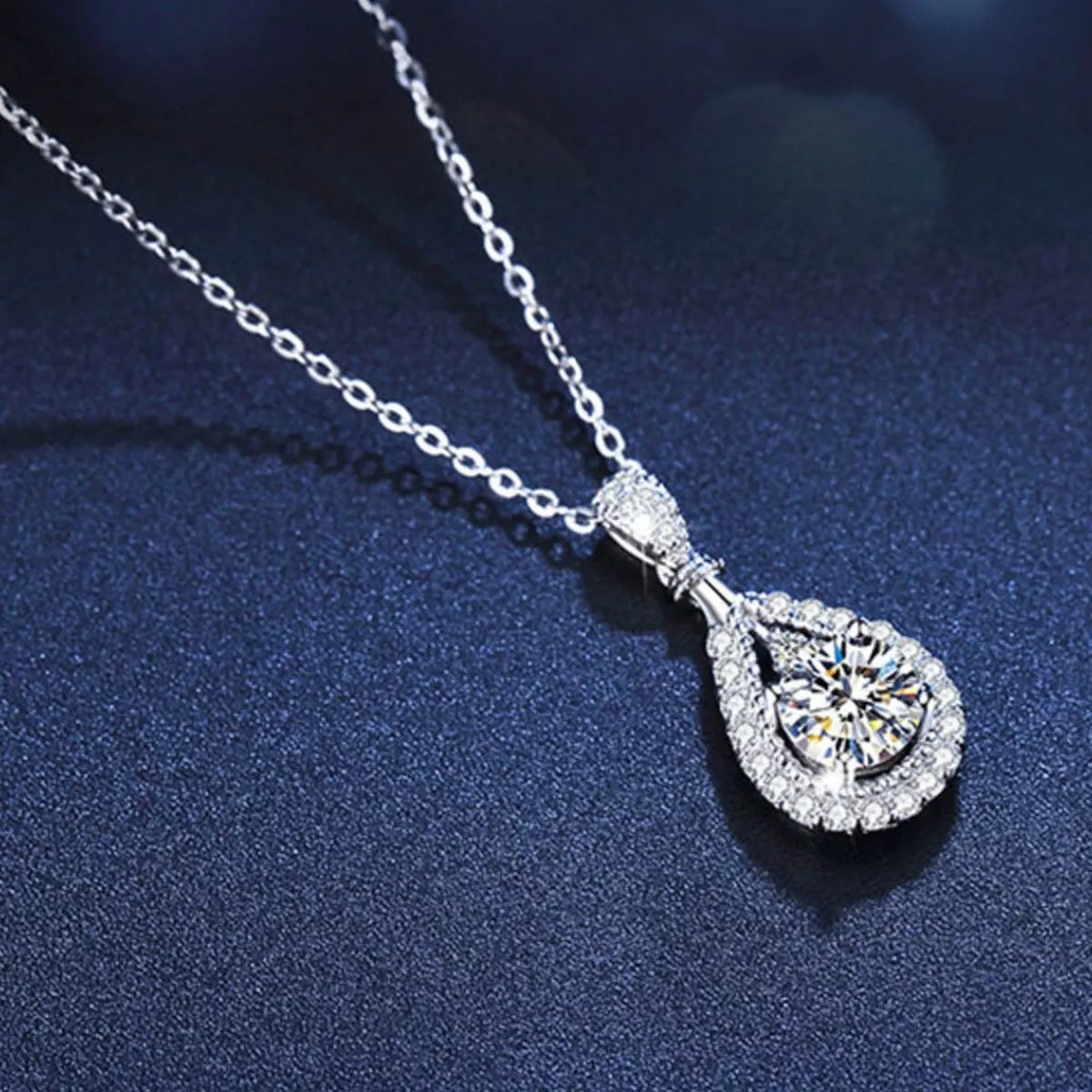 Close view of the large moissanite teardrop stone