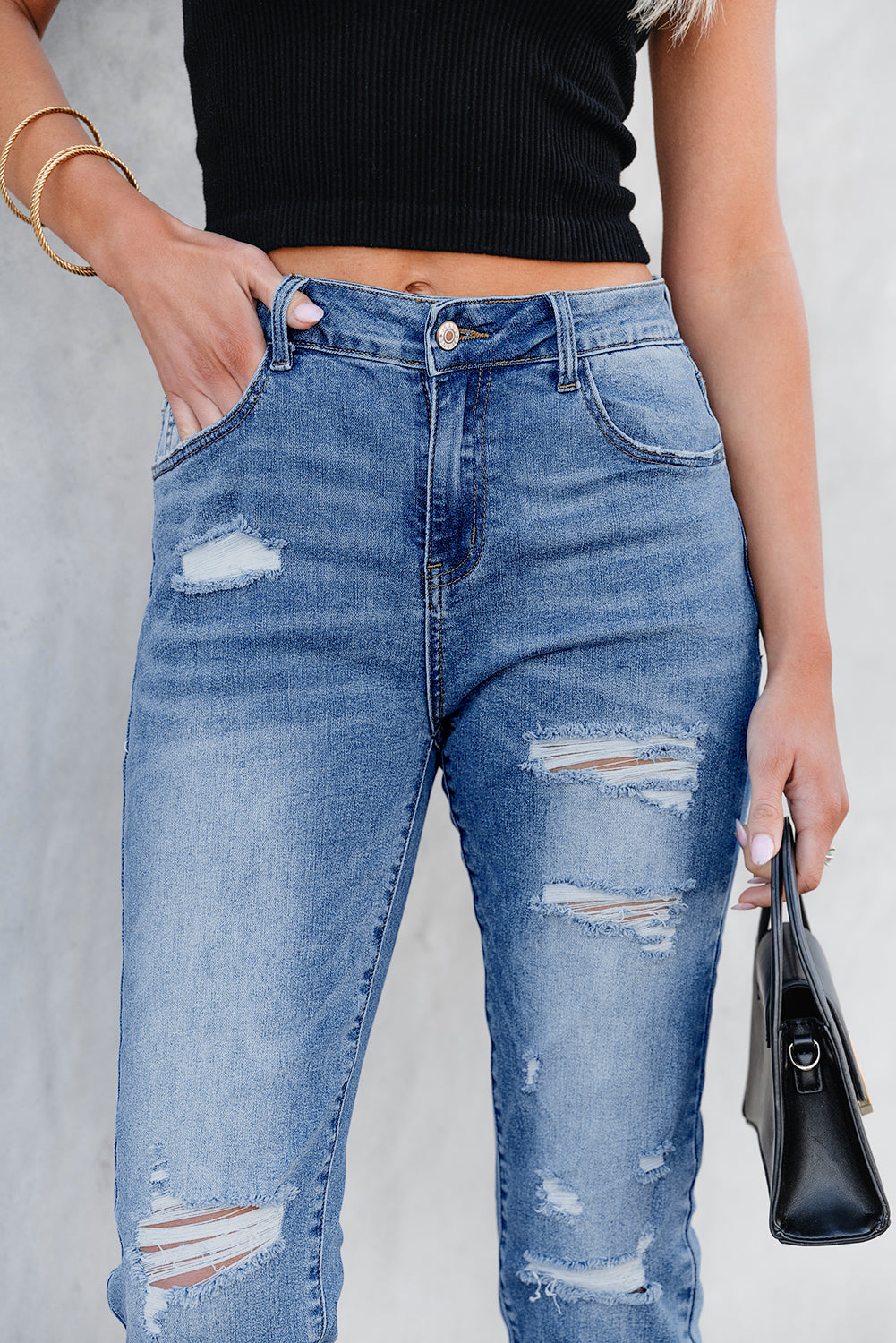 Sky blue capri jeans detail of distressed wash