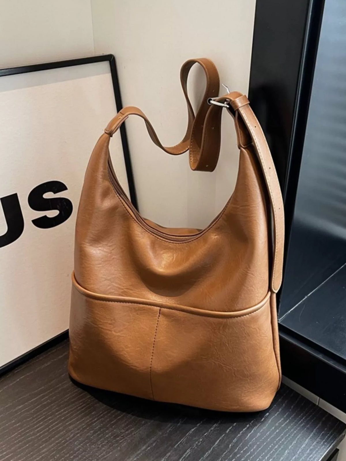 Brown leather shoulder bag with adjustable strap