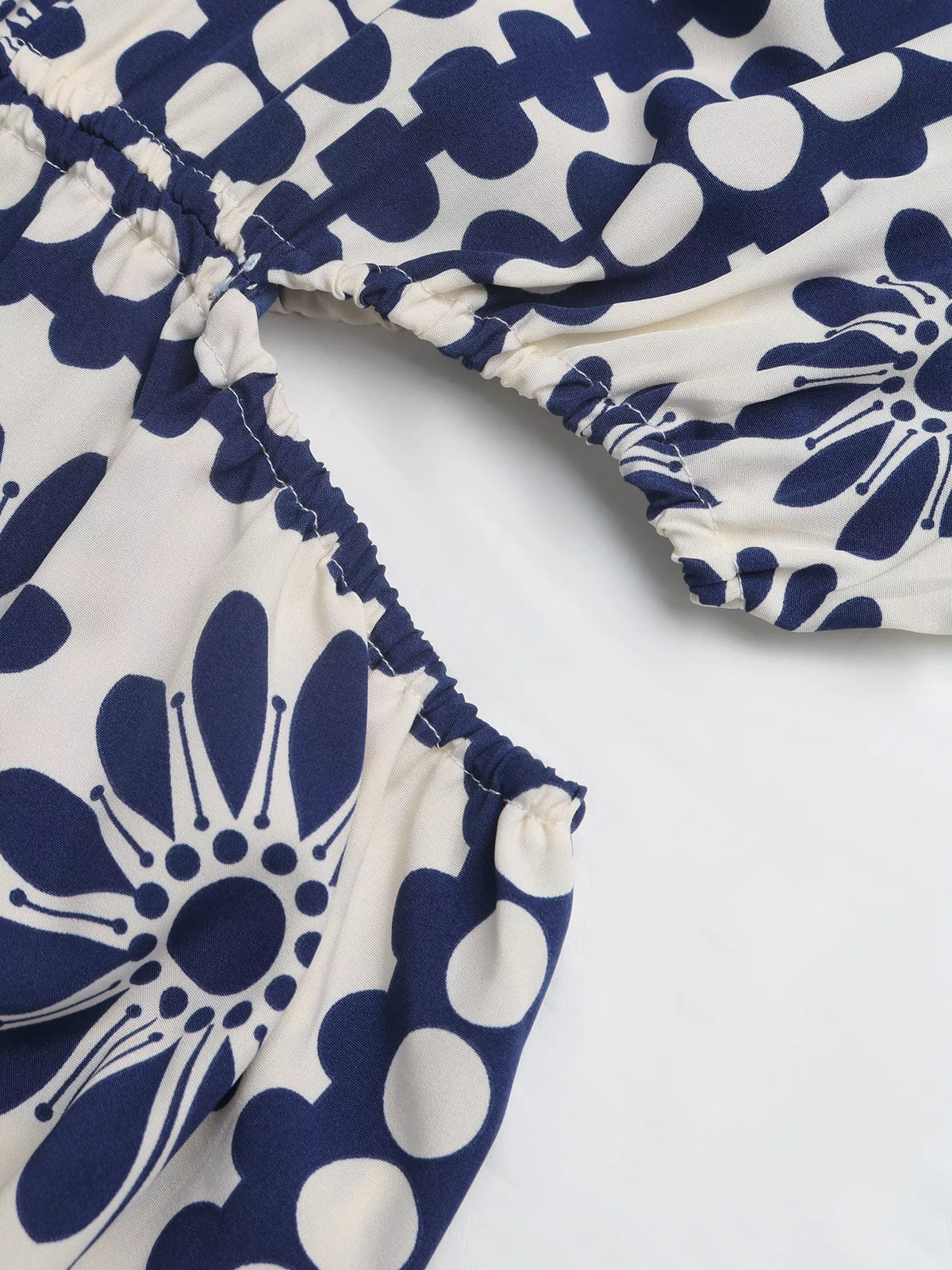 navy blue floral cutout waist maxi dress hemline detail