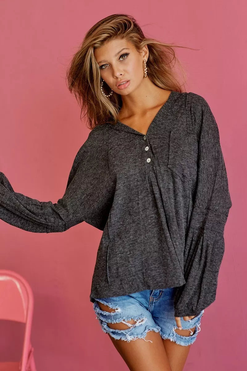Textured knit hoodie in black charcoal shown on model