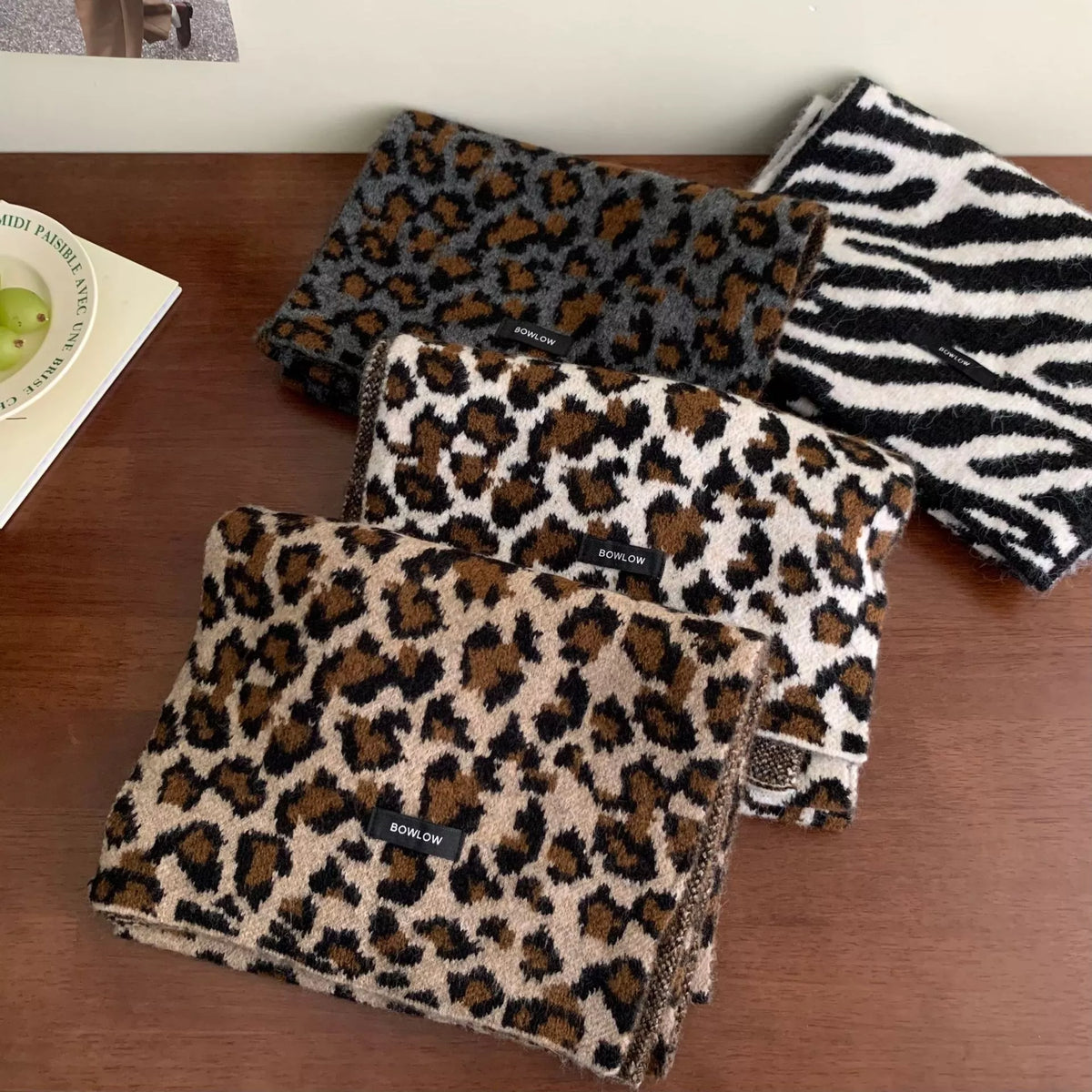 Animal print scarf styled with a neutral coat