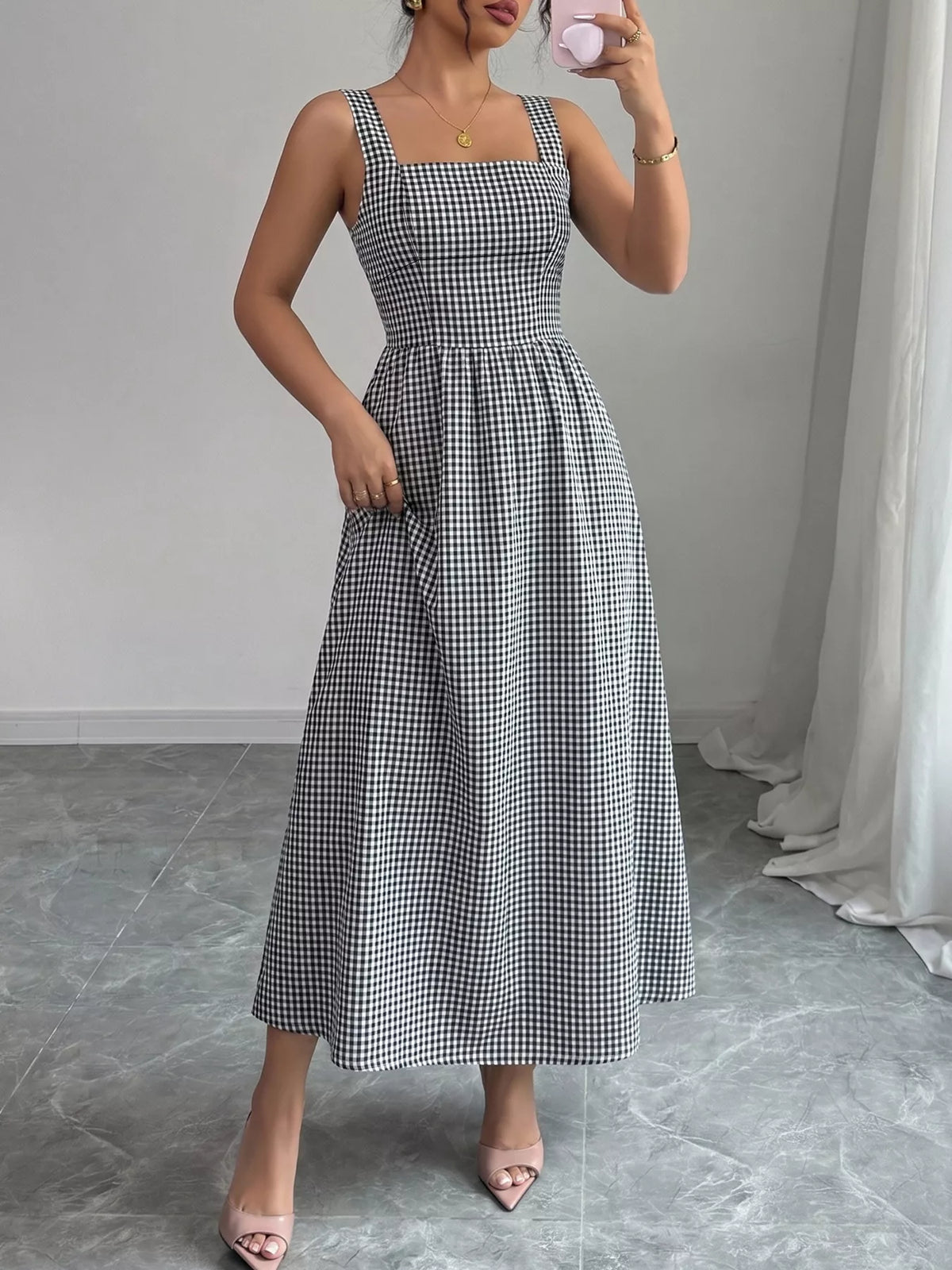 Black gingham dress shown from the back
