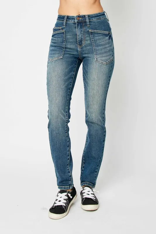 Dark wash skinny jeans side view showing tapered leg