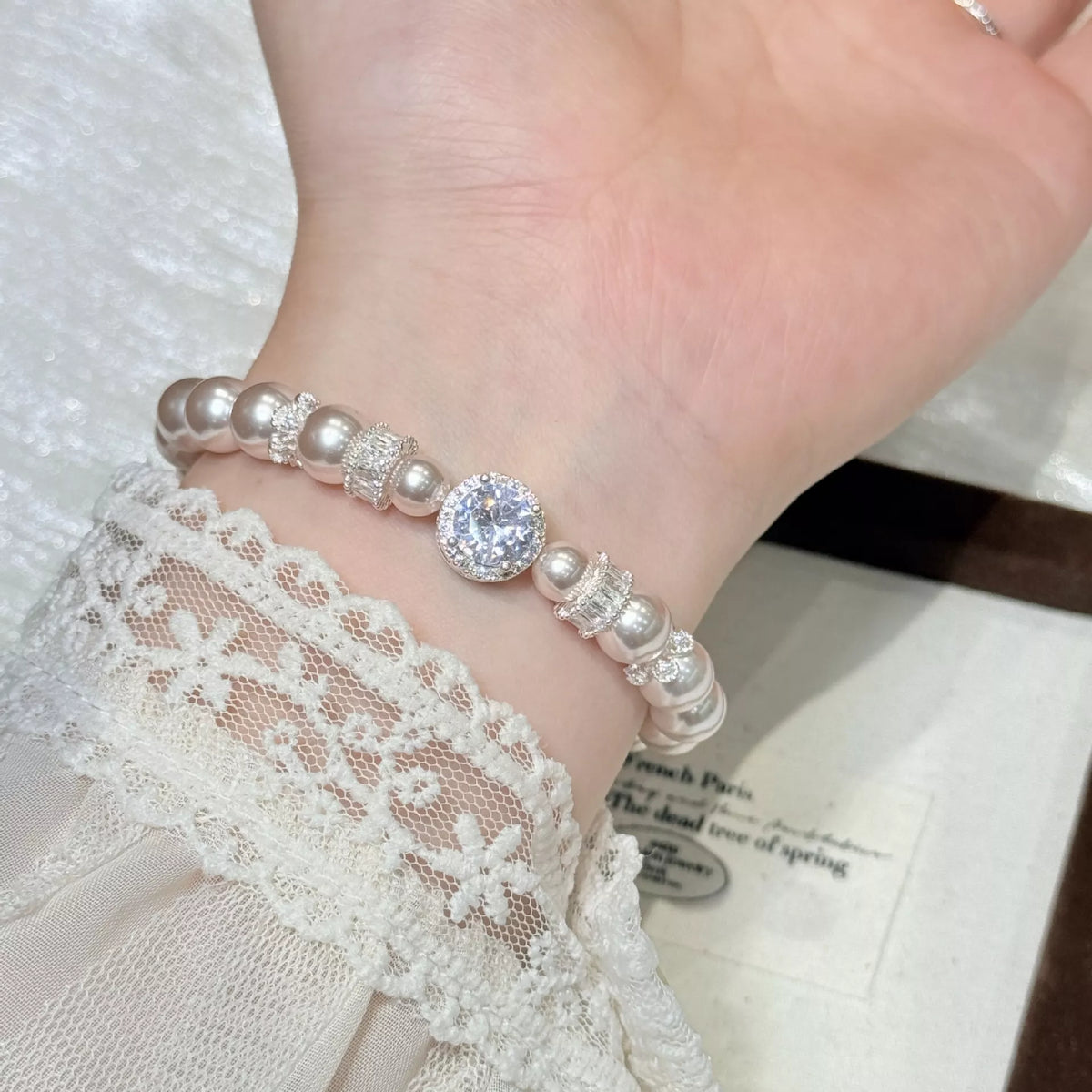 pearl and zircon chain bracelet styled outfit