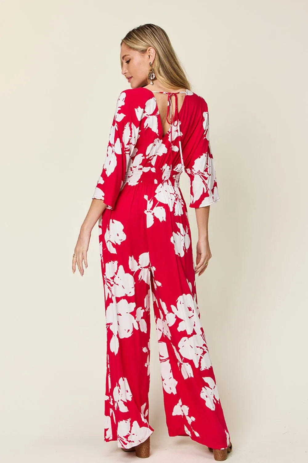 Wide leg jumpsuit hem and drape detail