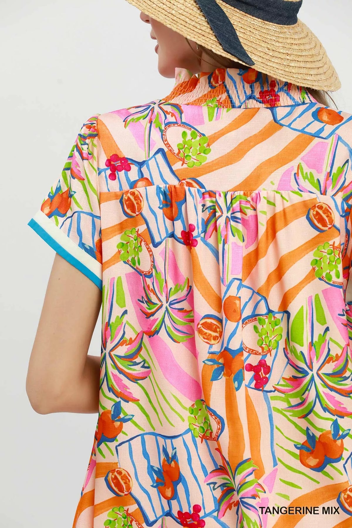 Tangerine tropical print collared shift dress close up view