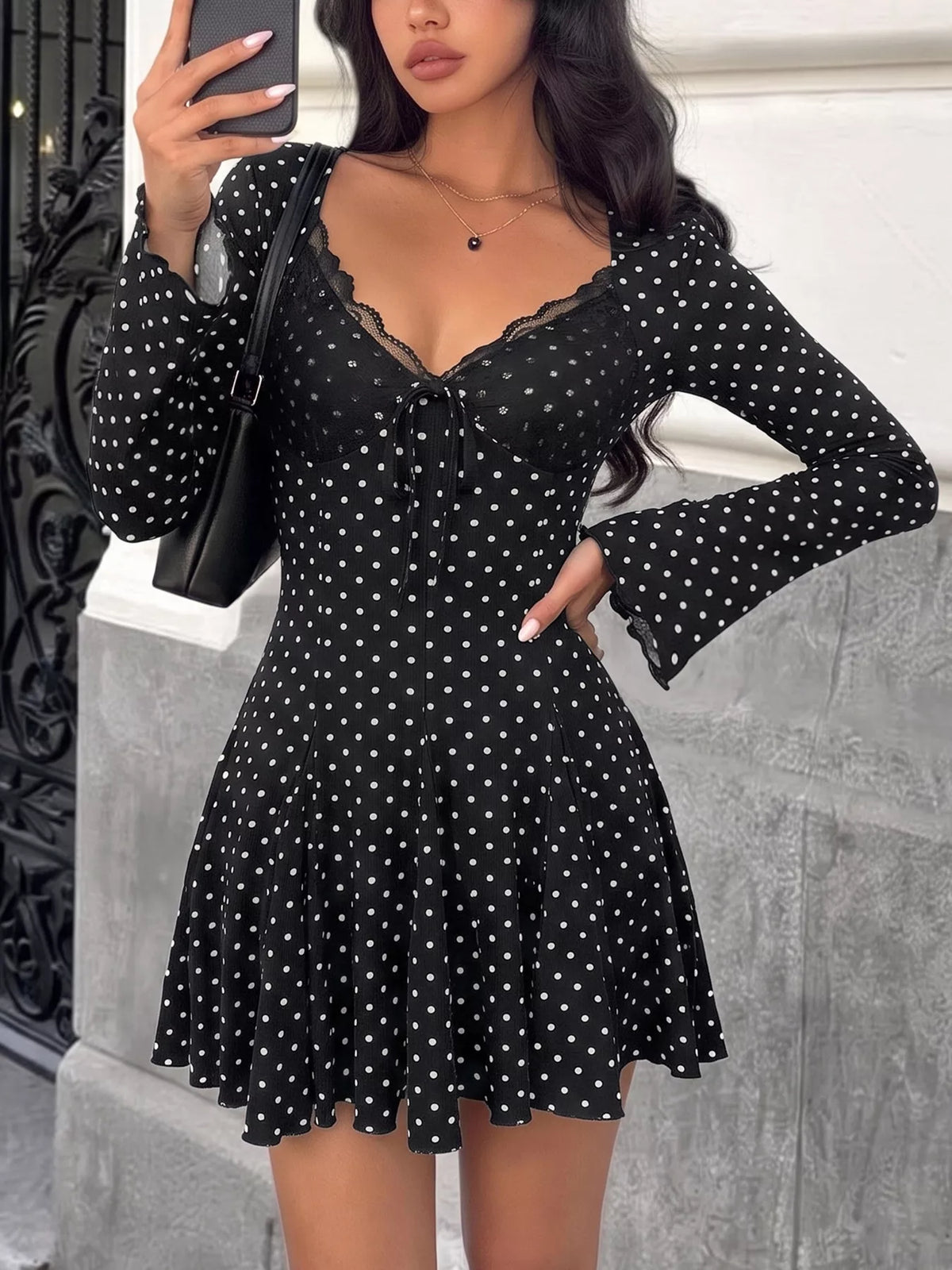 Black polka dot lace trim mini dress, front view