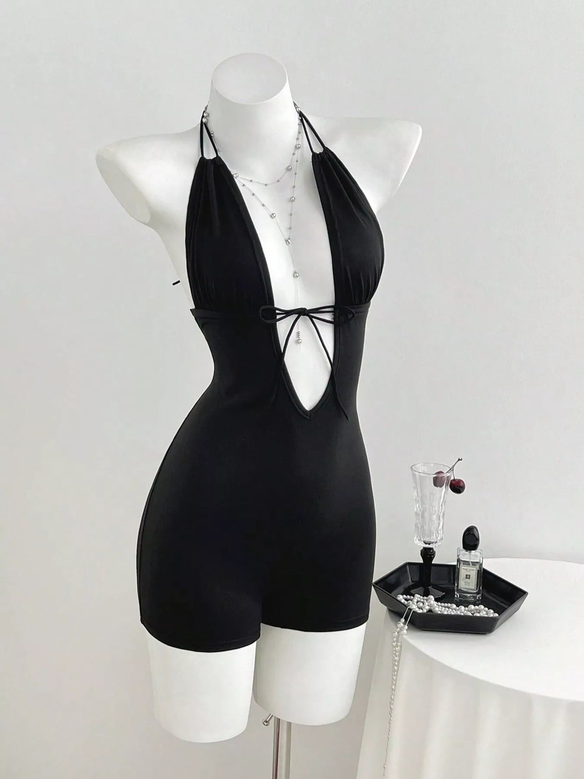 Black halter neck romper side view