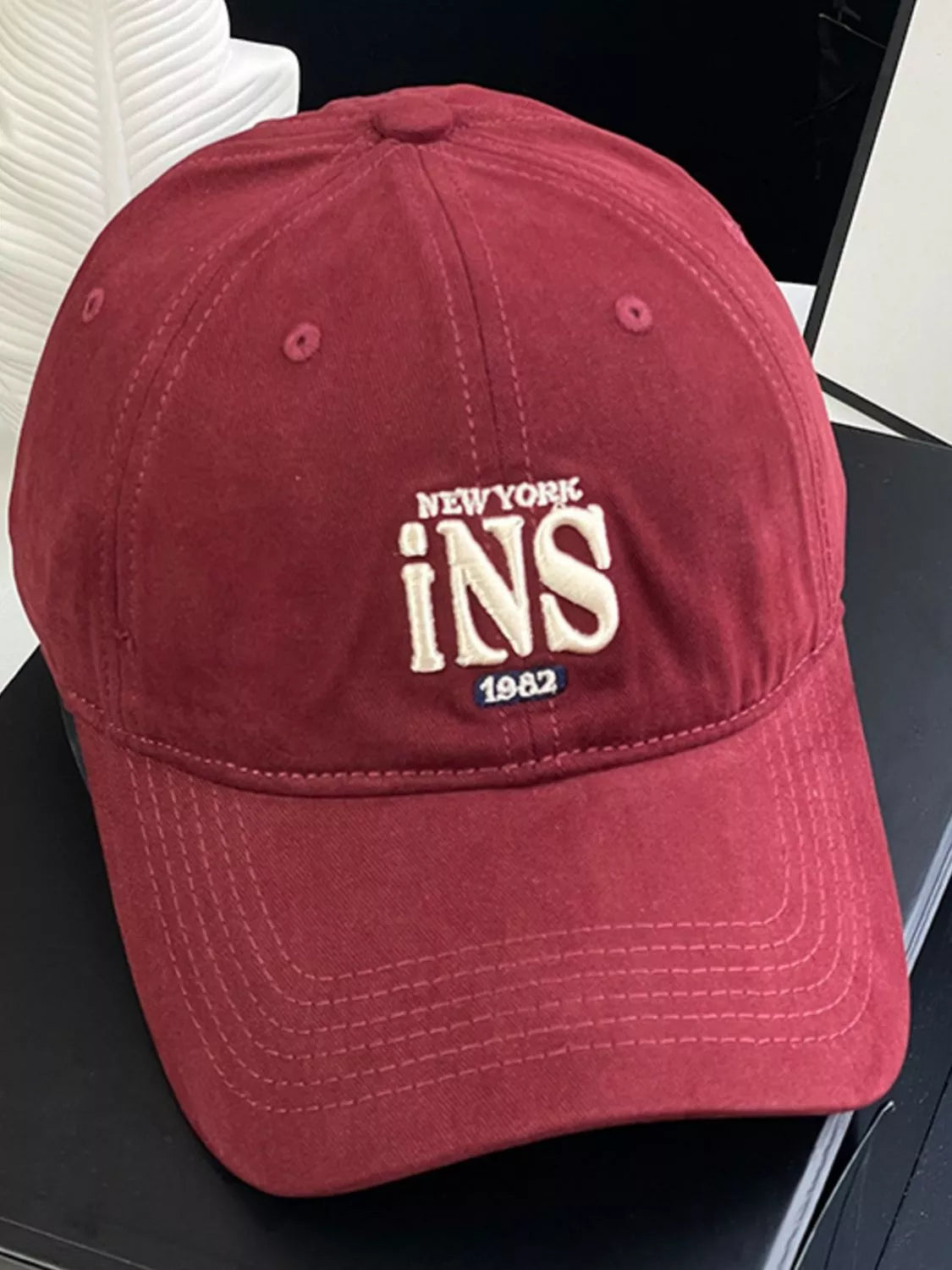 Embroidered baseball cap shown in pink