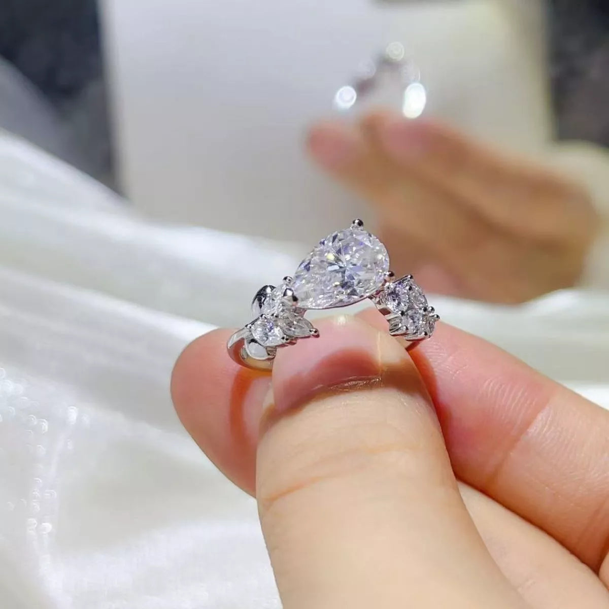 Close up of moissanite stone and silver setting