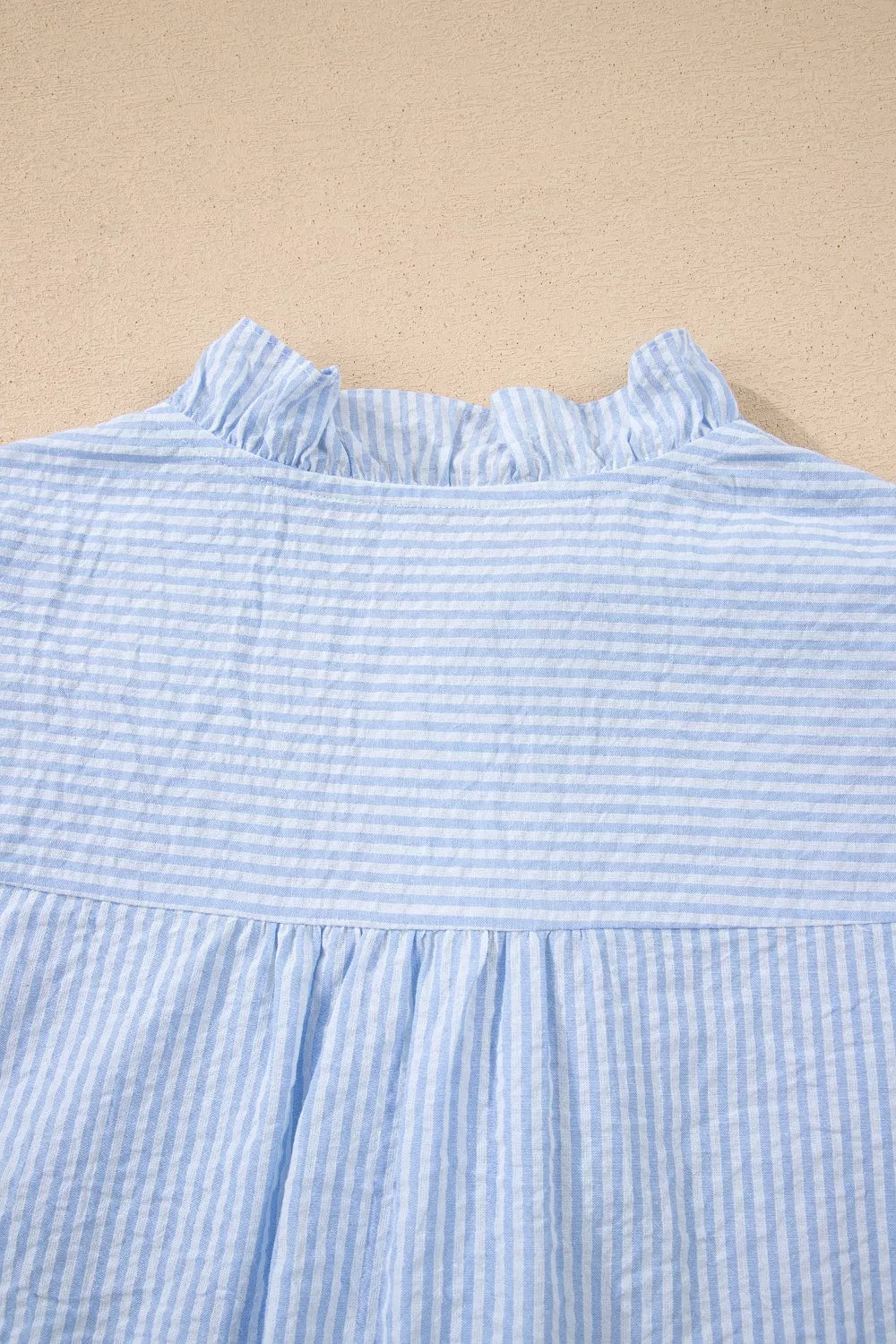 Light blue striped floral embroidered puff sleeve shirt back view