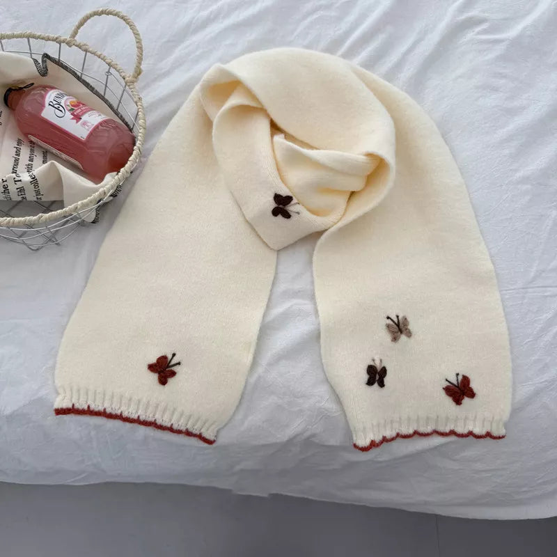 Butterfly embroidered scarf shown in a rich color