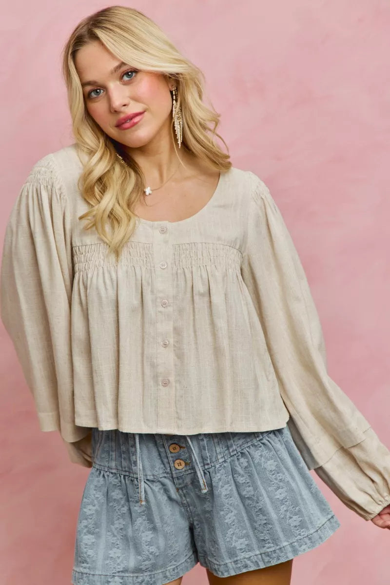 Cream linen blend smocked long sleeve top, side view