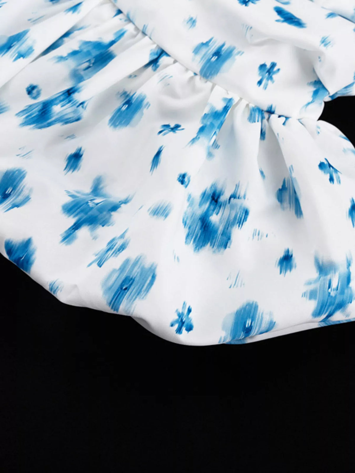Three quarter view of the ruffle hem tank