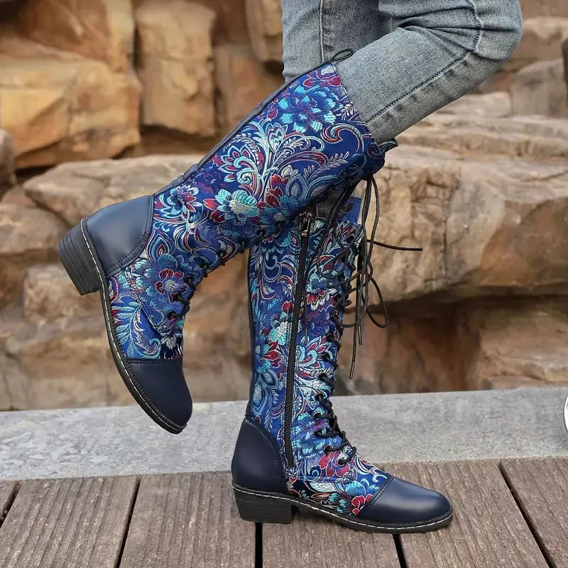 Embroidered knee high boots styled with denim