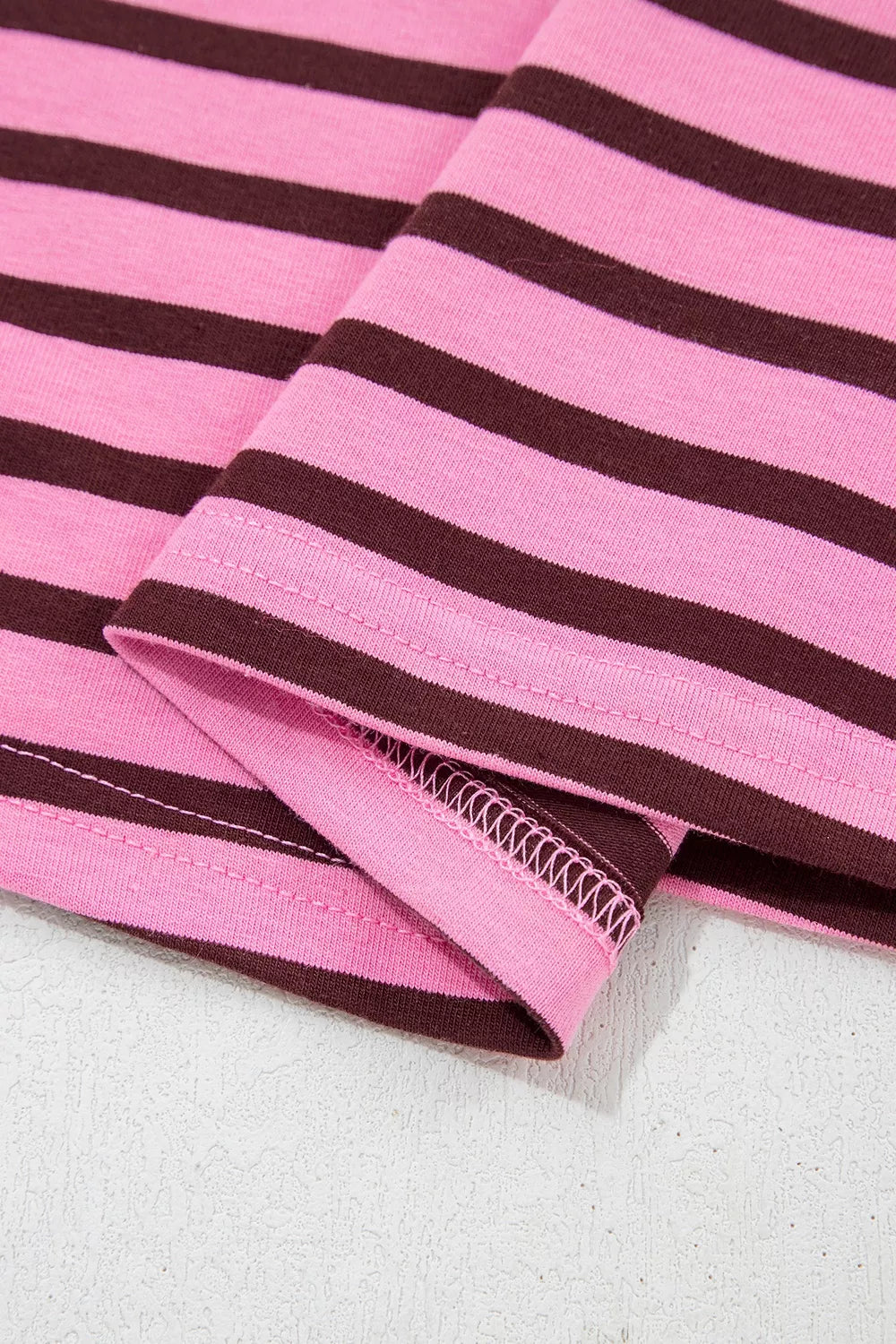 Full length styling shot of the fuchsia pink striped top