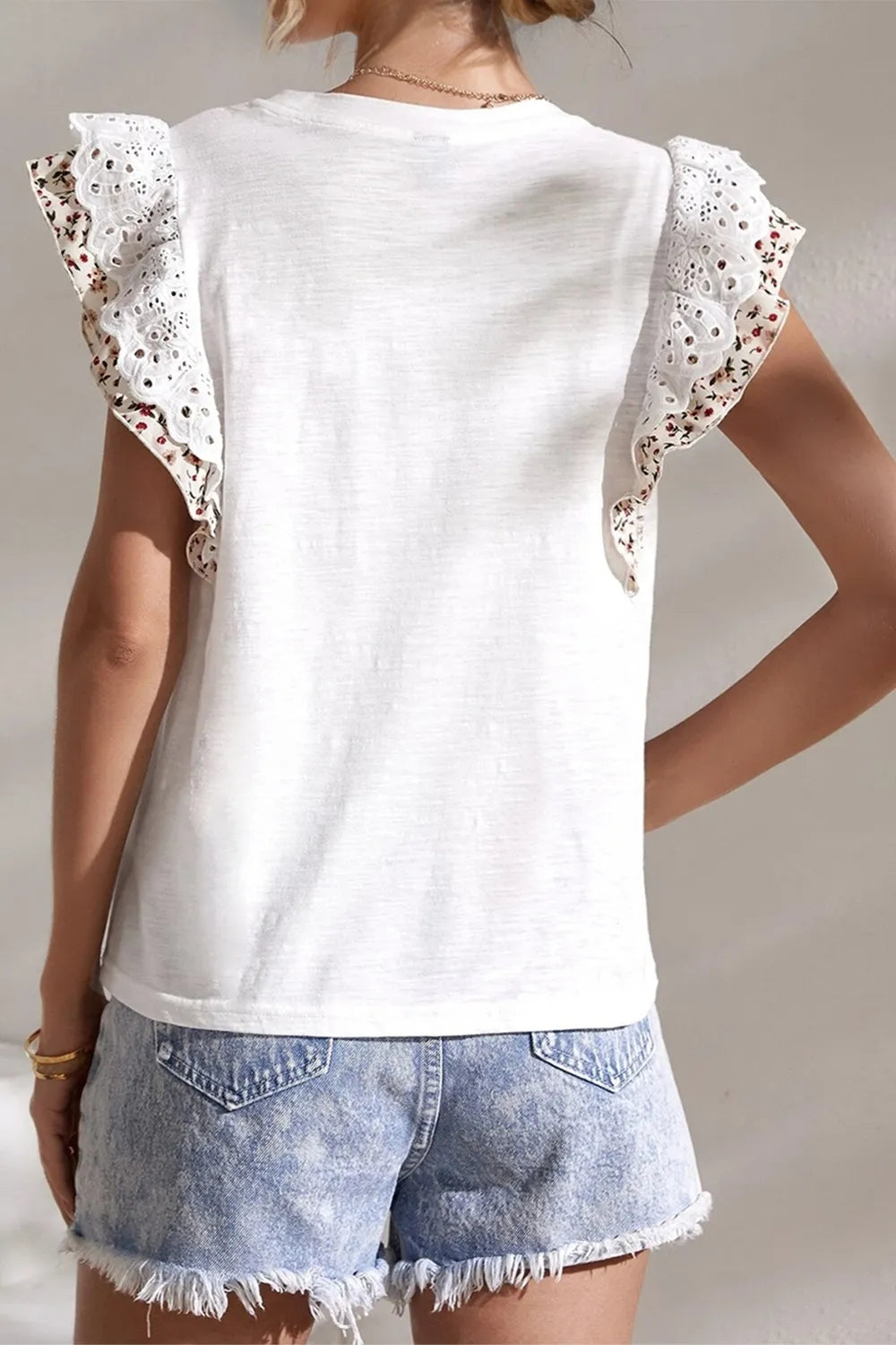 Round neck ruffled top side view