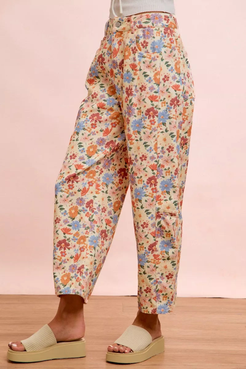 Side view of the floral barrel pants showing the curved leg shape