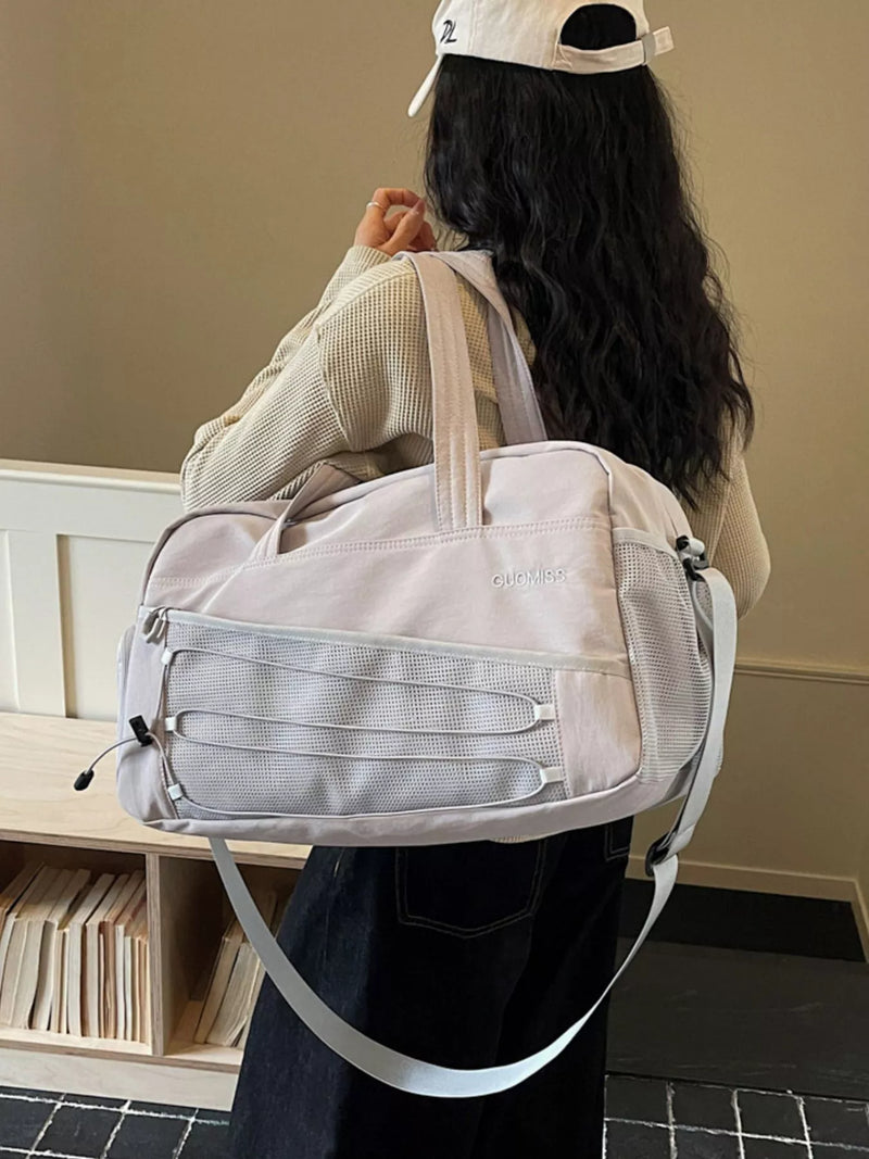 Lightweight nylon travel duffel bag in grey front view