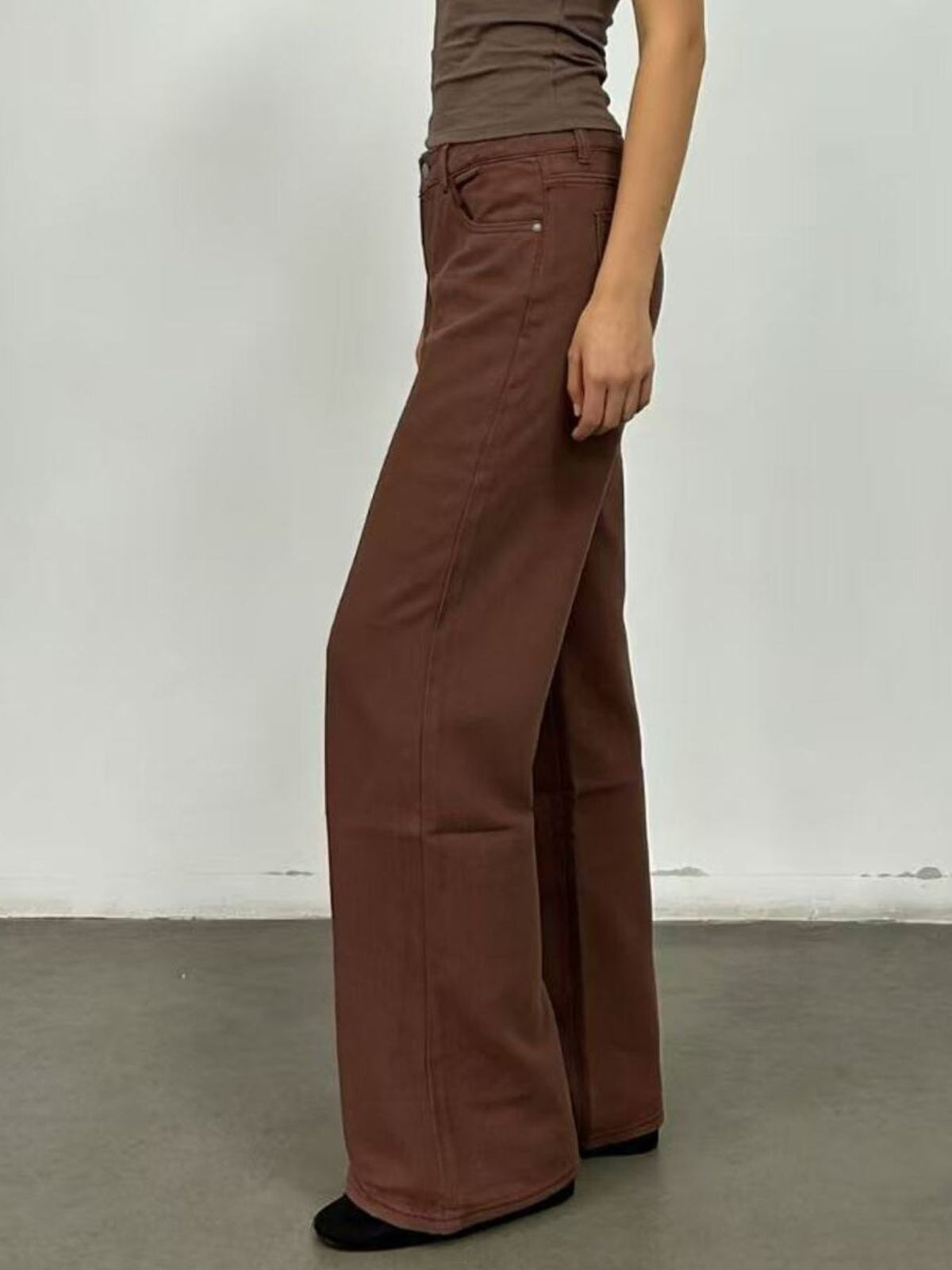 Angled view of butterfly back wide leg jeans