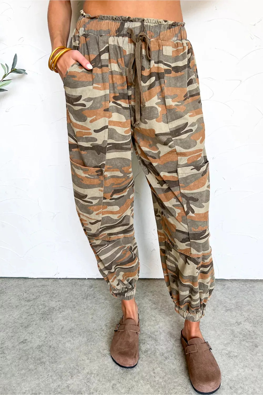 Taupe camouflage jogger pants front view on model
