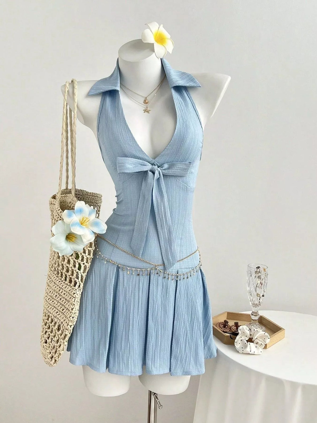 Light blue halter neck bow pleated mini dress front view