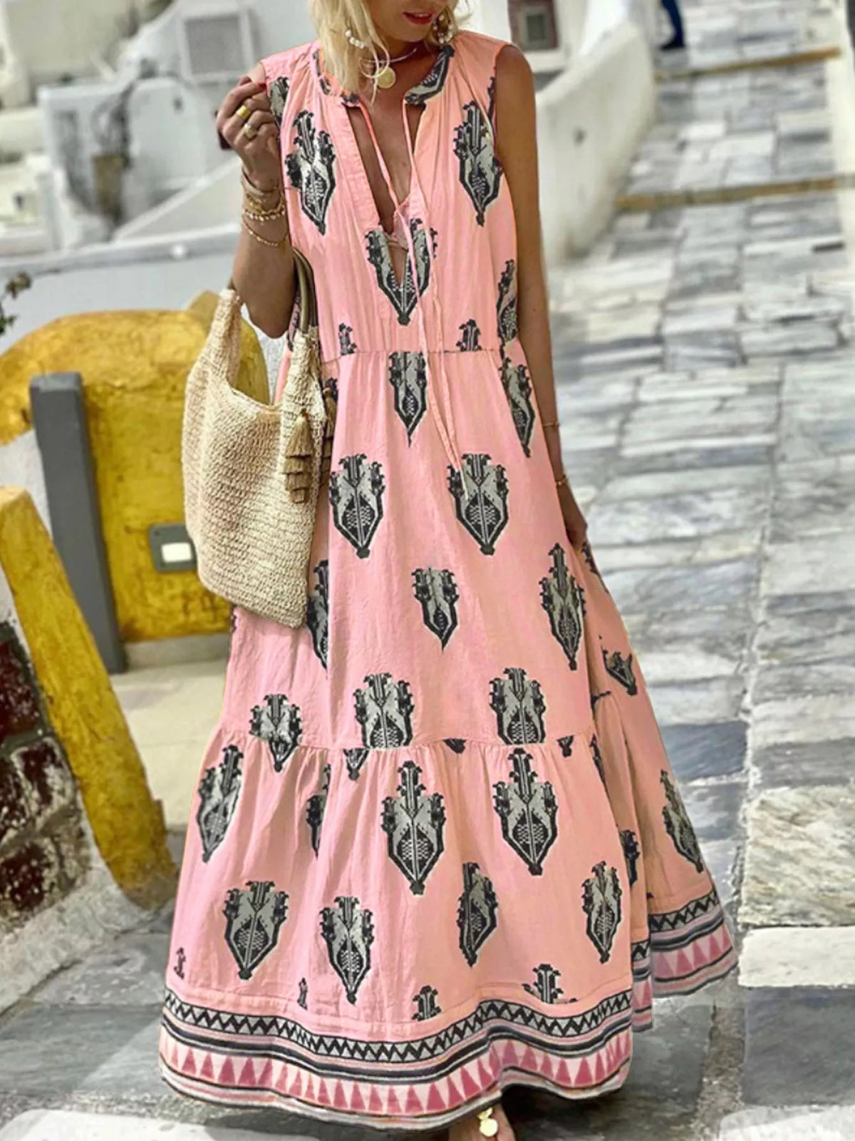 Printed sleeveless tiered maxi dress, fabric and print detail