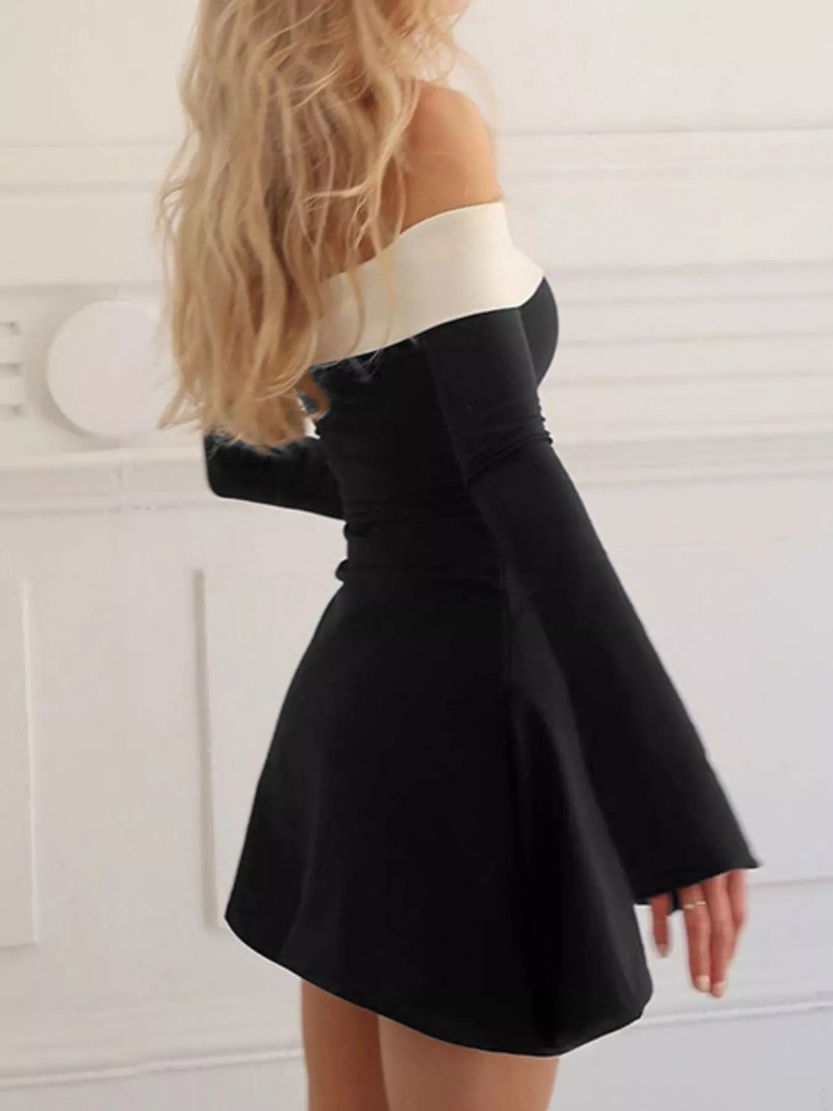 off shoulder bell sleeve mini dress in black back view