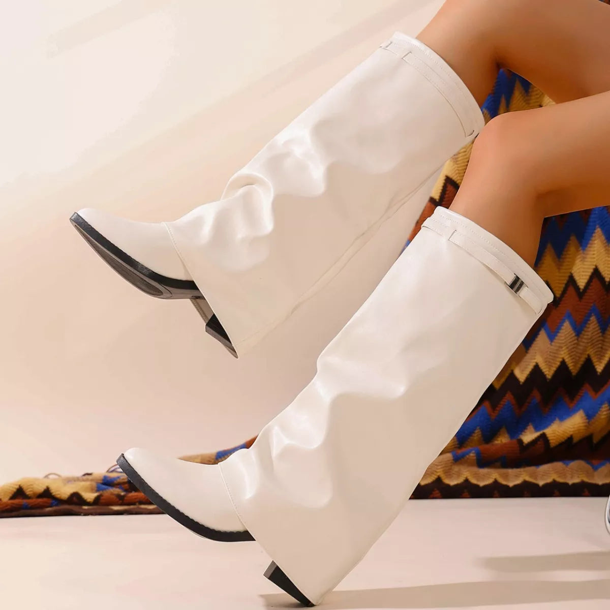 Pointed toe block heel boots detail of the upper