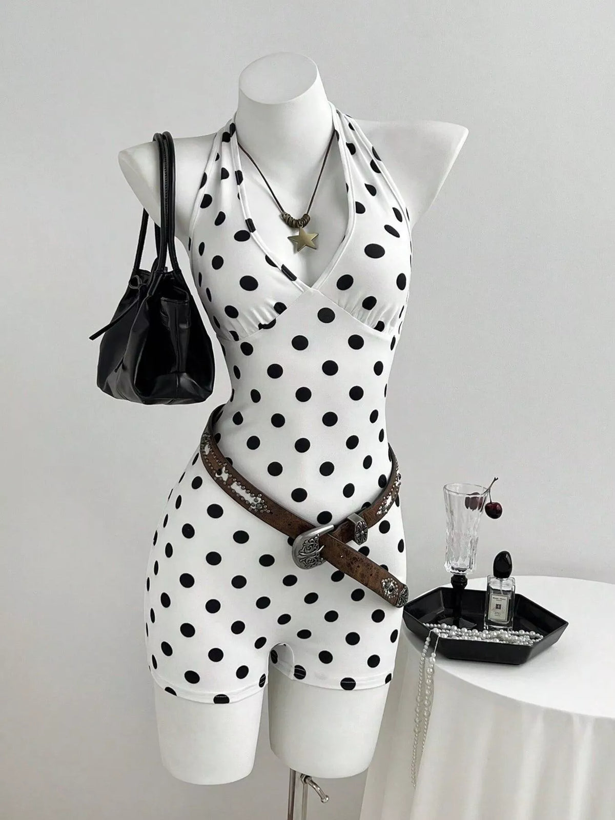 White polka dot halter neck romper front view