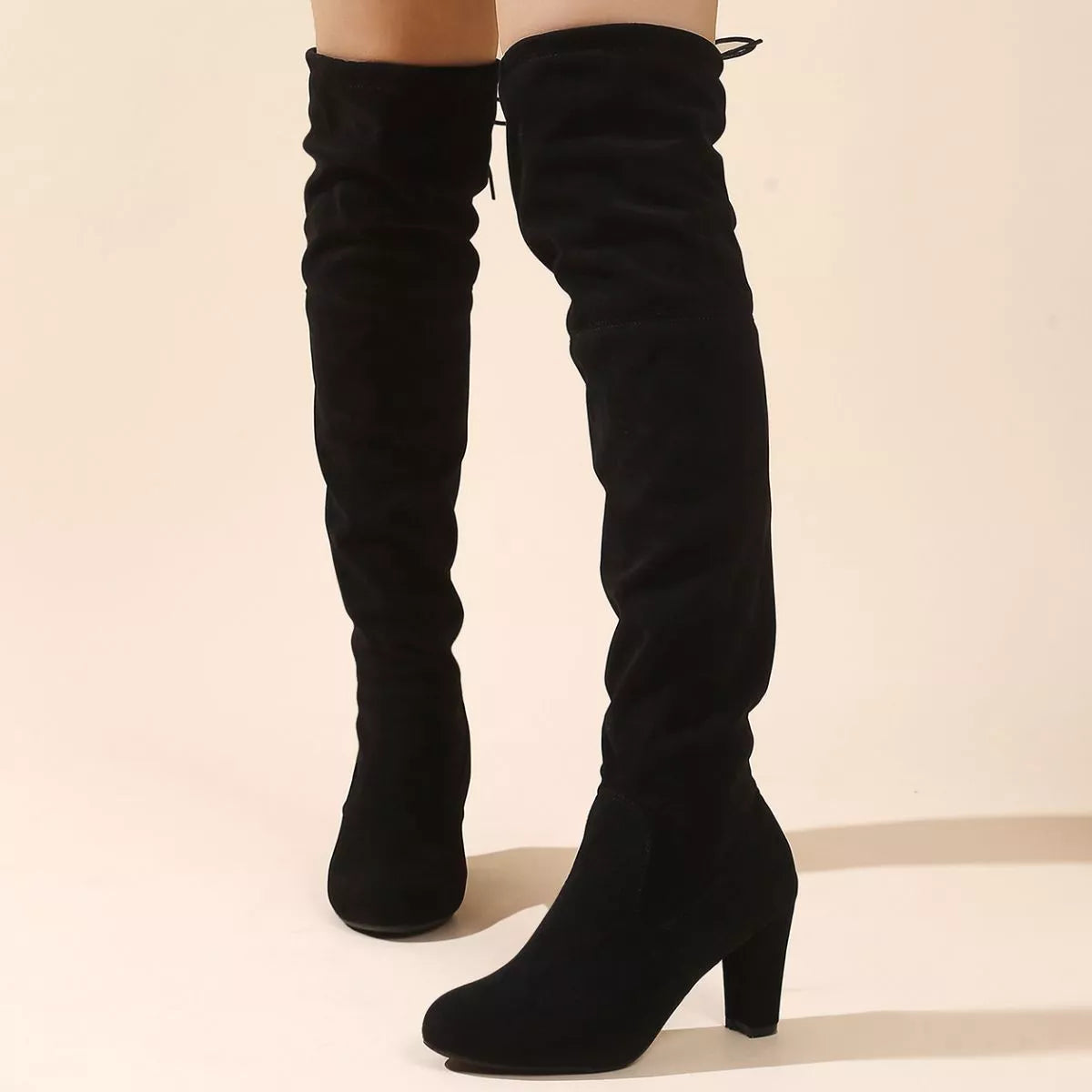 Over the knee high heel suede boots heel detail